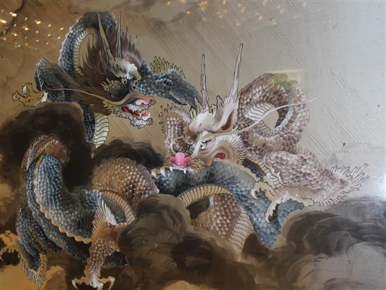 A large Japanese embroidered silk dragon panel, early 20th century, 72.5 x 119cm, framed and glazed